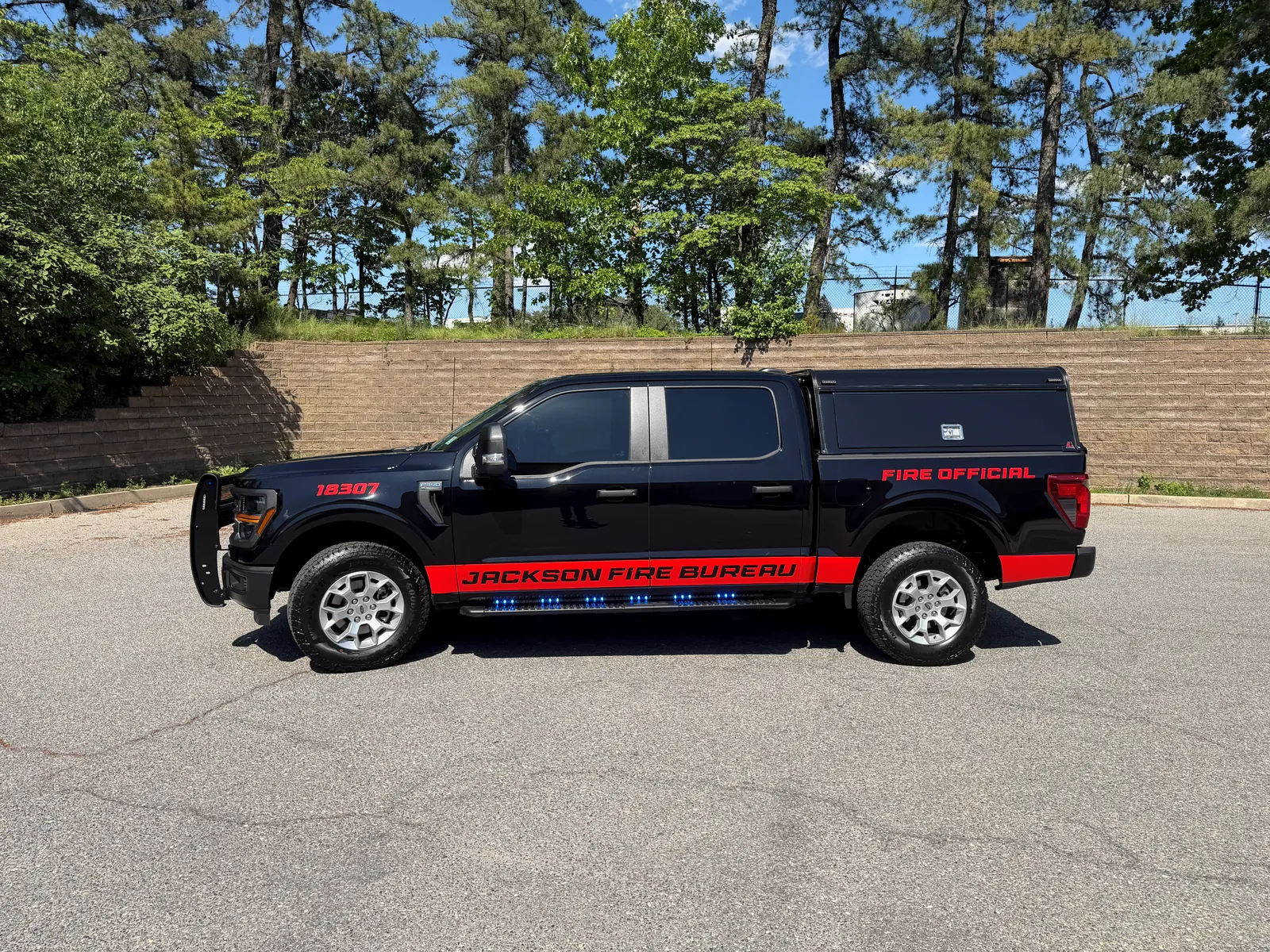 JACKSON FIRE BUREAU stripes + lettering — driver side